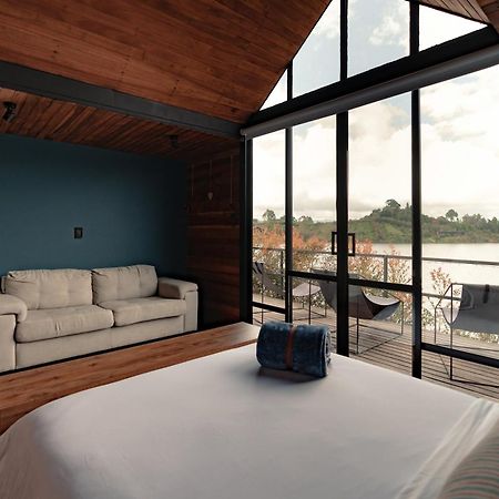 Guatapé The Boato Hotel מראה חיצוני תמונה A bedroom in a house